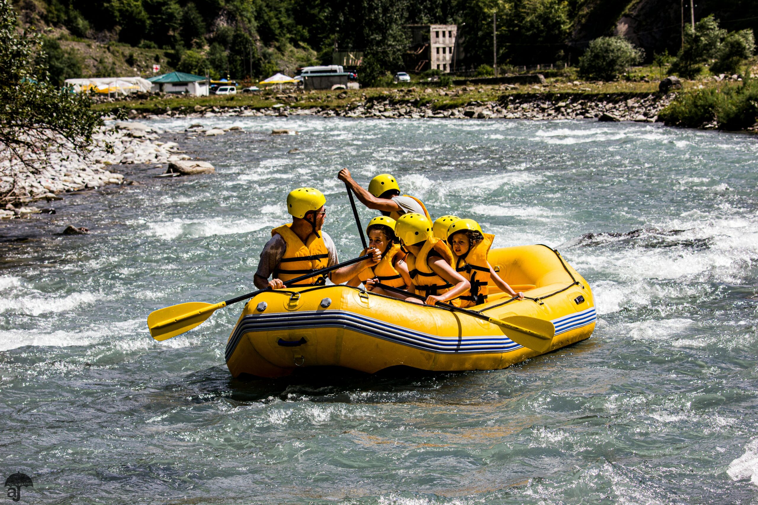 Experience thrilling rafting on the Aragvi River in Ananuri, Georgia, with a vibrant group.